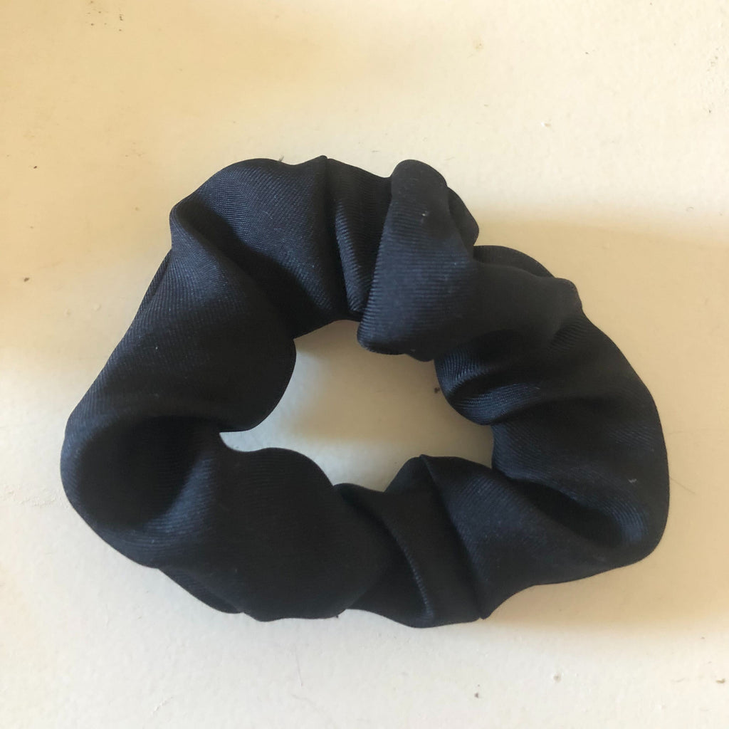 scrunchie in black silk twill by scout. the label
